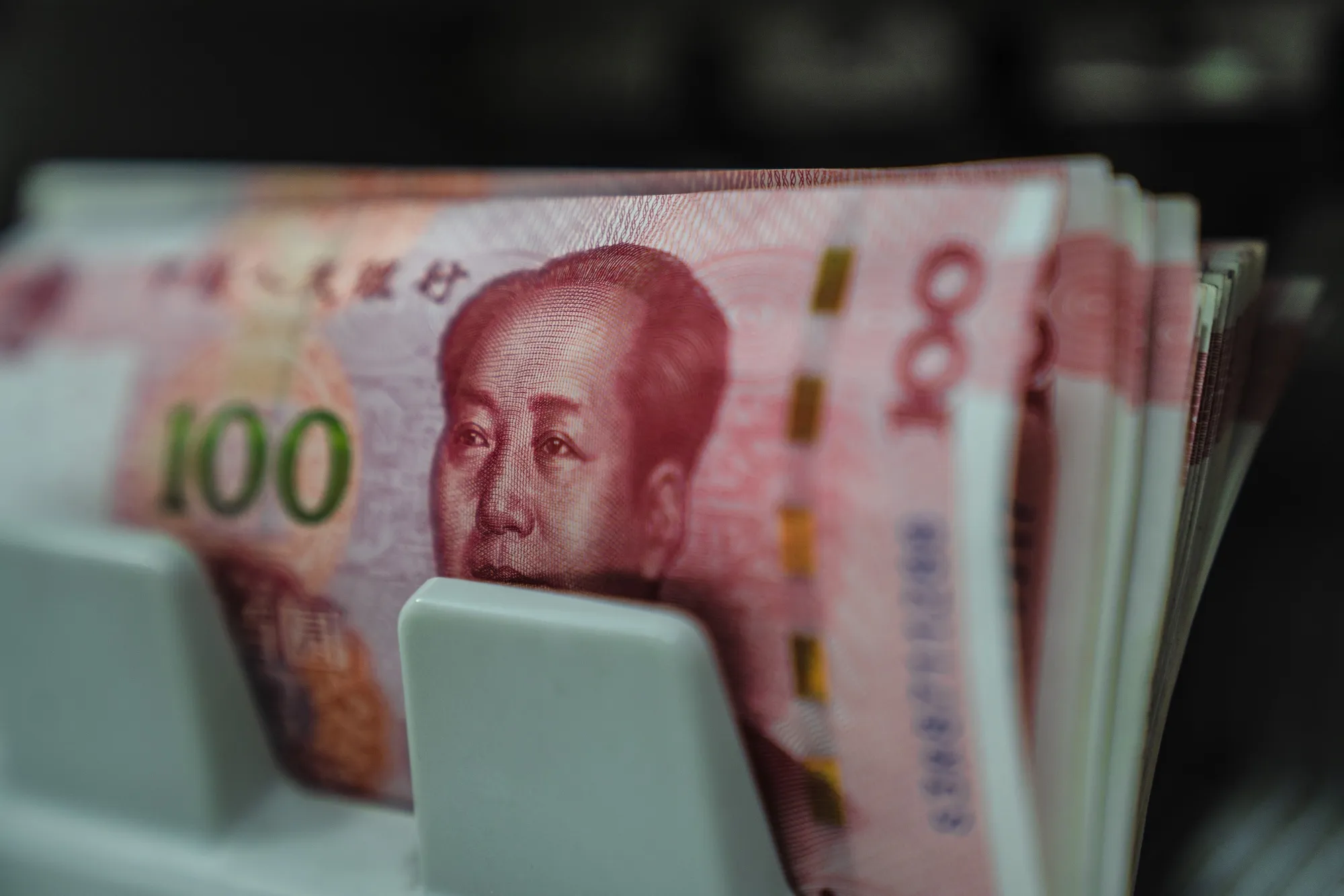 Chinese banknotes in a counting machine in Hong Kong.&nbsp;&nbsp;