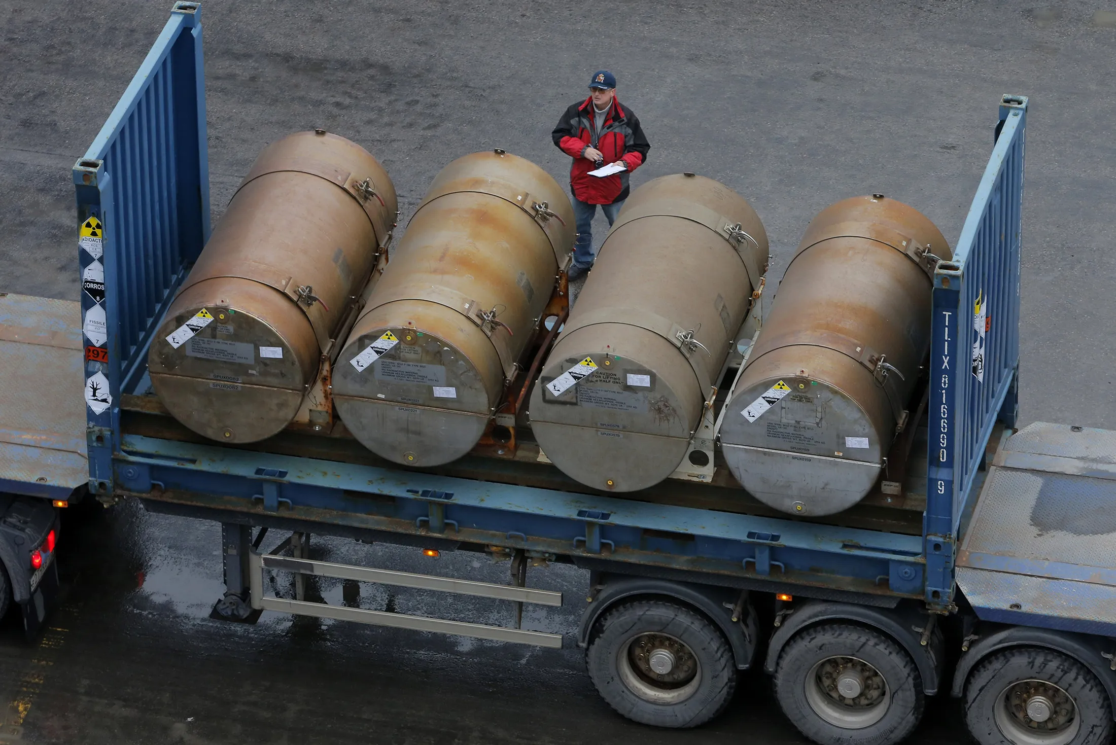 A truck carries containers with low-enriched uranium to be used as fuel for nuclear reactors, on a port in St. Petersburg, Russia.