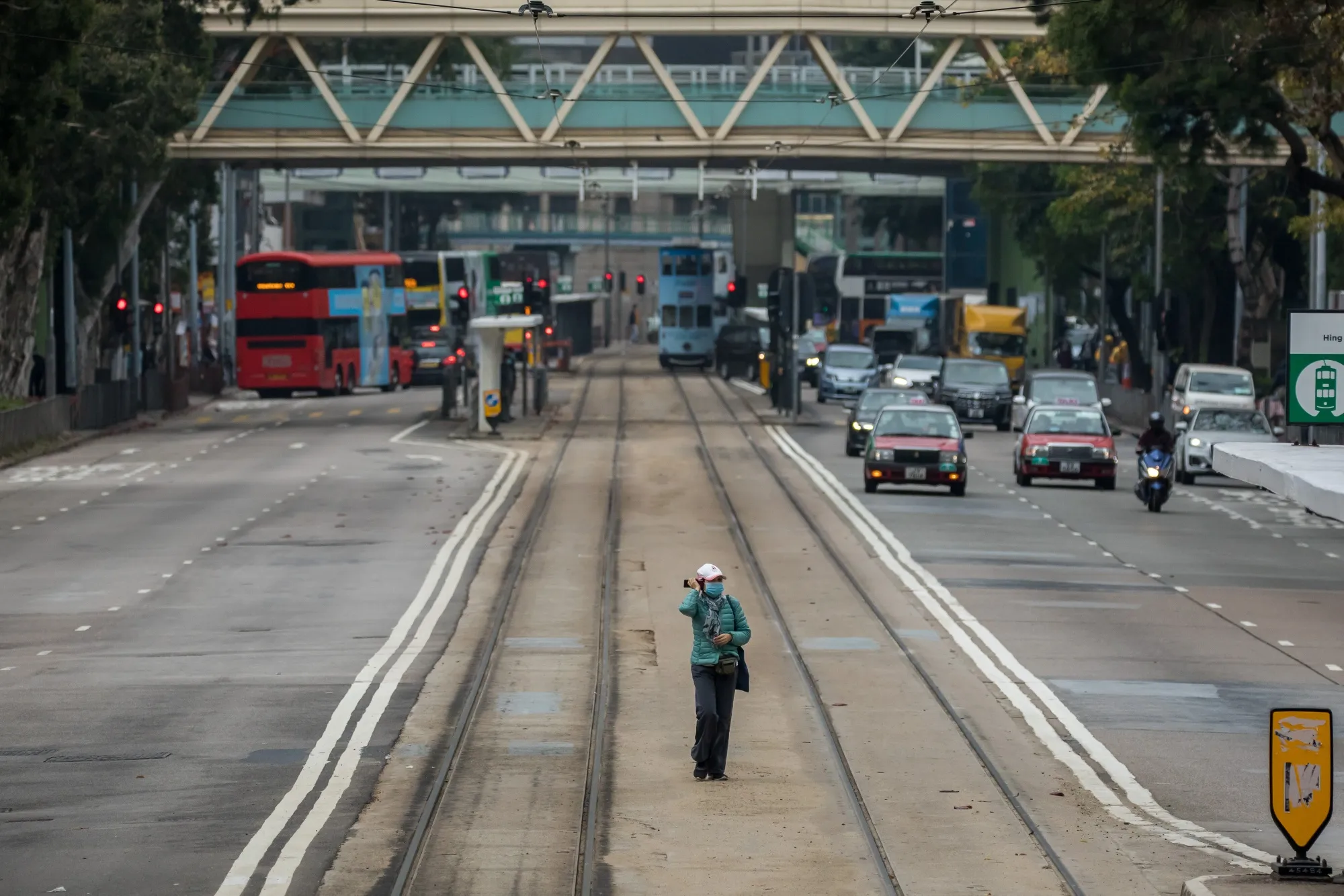 A pedestrian wearing a protective mask walks on a street in Hong Kong on&nbsp;Feb. 11.