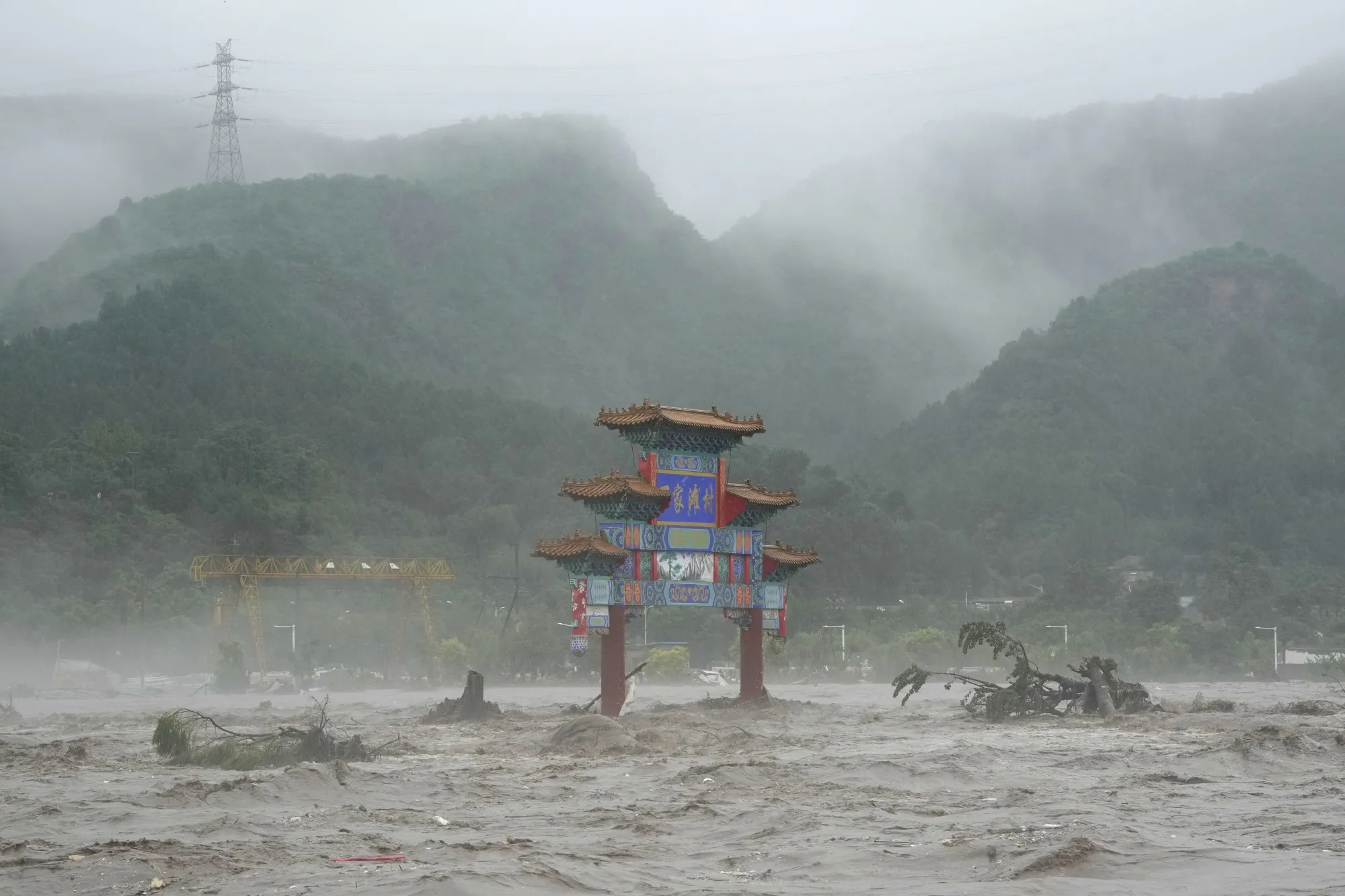 Flood waters in the Miaofengshan area on the outskirts of Beijing on Aug. 1.