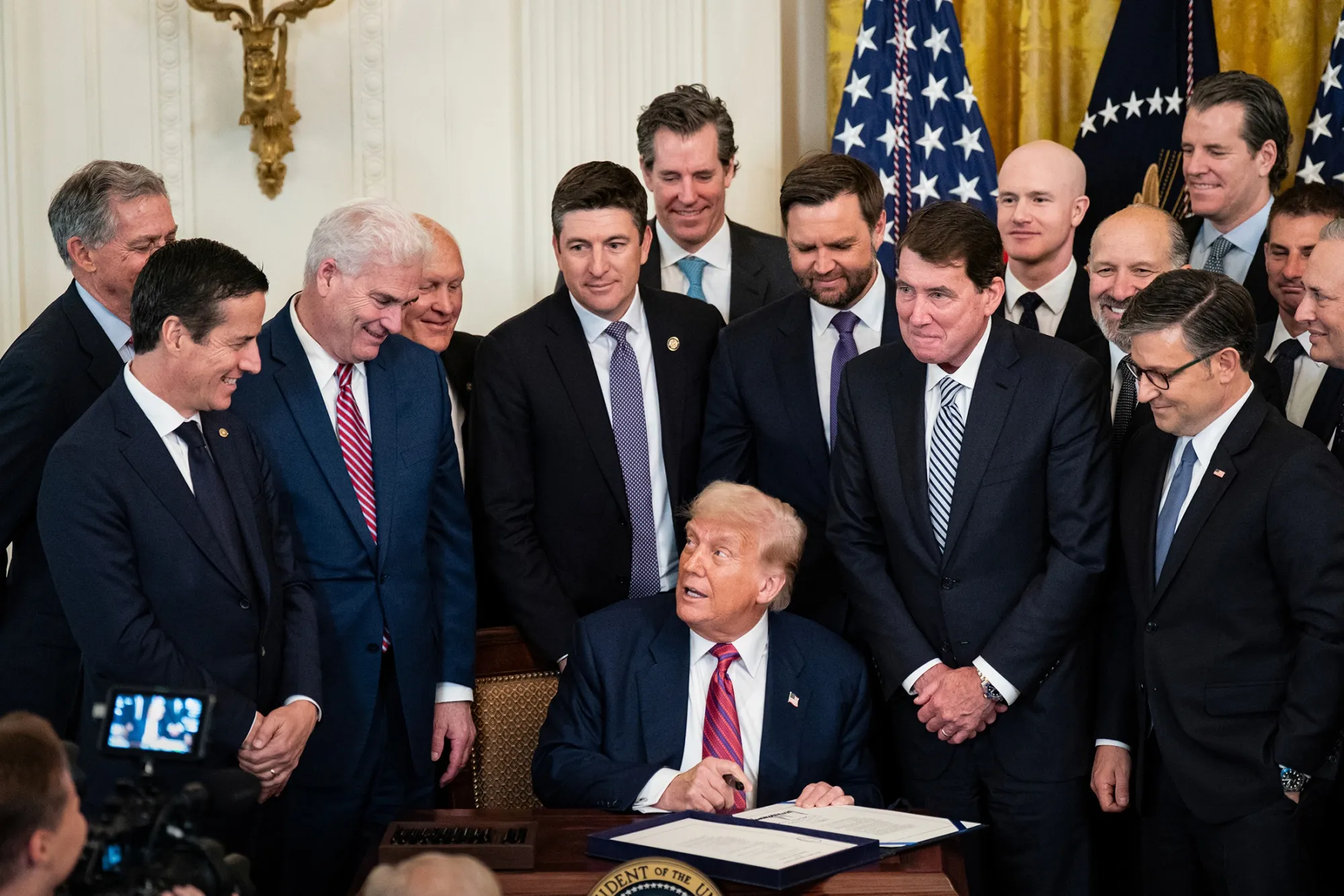 US President Donald Trump signs the GENIUS Act during a ceremony at the White House in Washington on July 18, 2025.