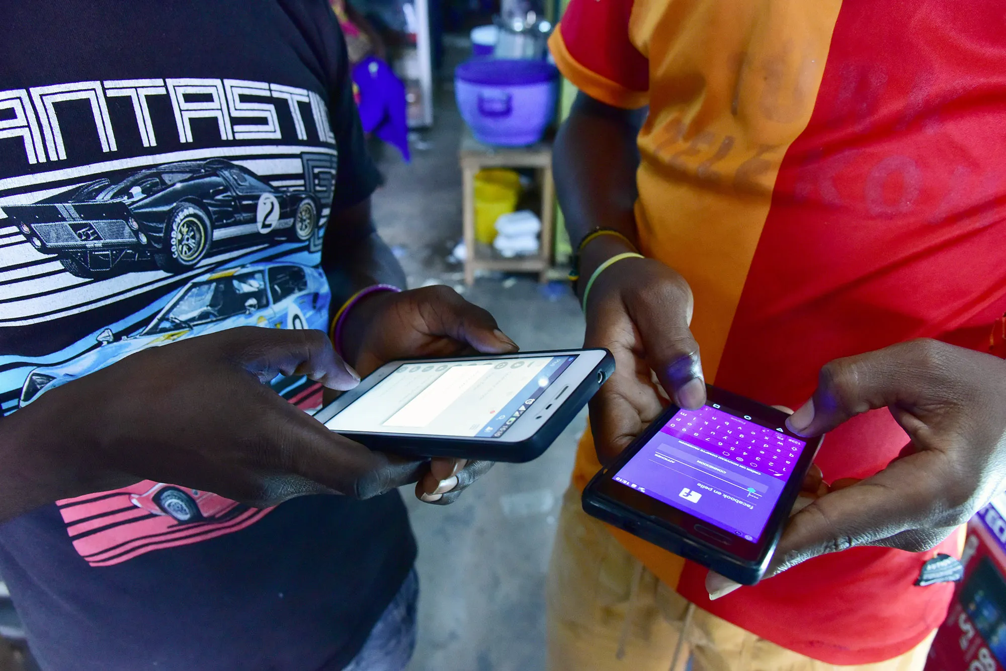 People browse internet articles on Facebook in Abidjan, Ivory Coast.