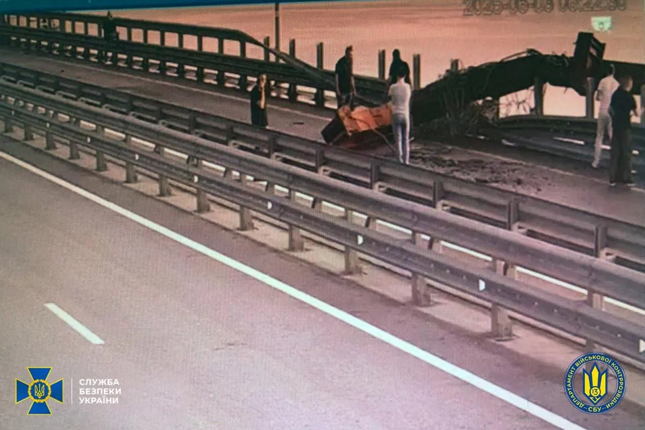 Locals survey the damage to&nbsp;the&nbsp;Crimean Bridge in Kherson Oblast, Ukraine, in a photo released by the Security Service of Ukraine, on June 3.