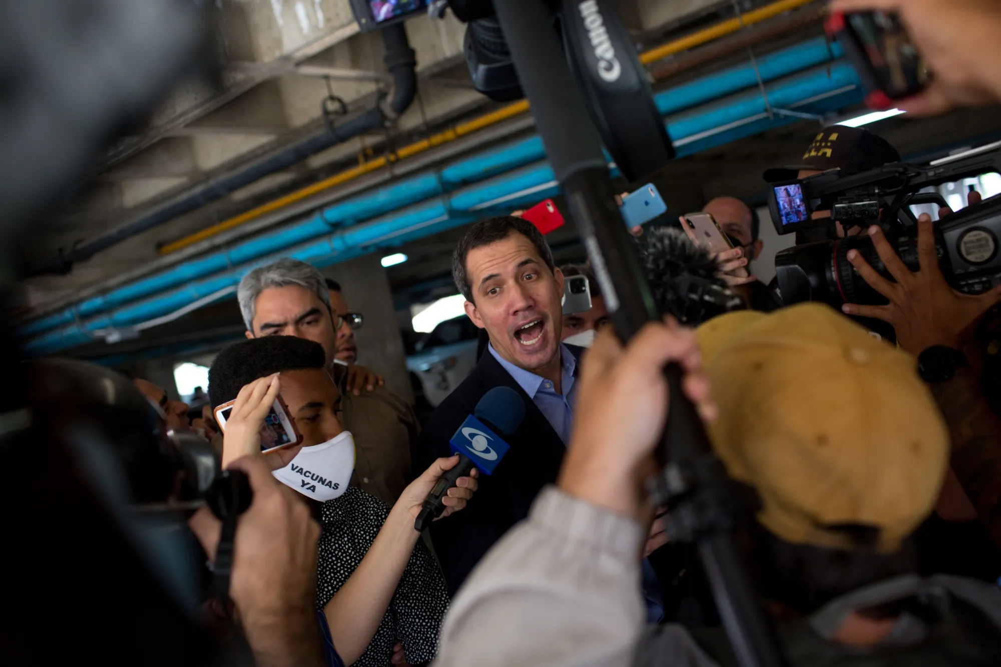 Juan Guaido speaks with members of the media after he said heavily-armed security officers penetrated his apartment building, threatening him with arrest&nbsp;on July 12.