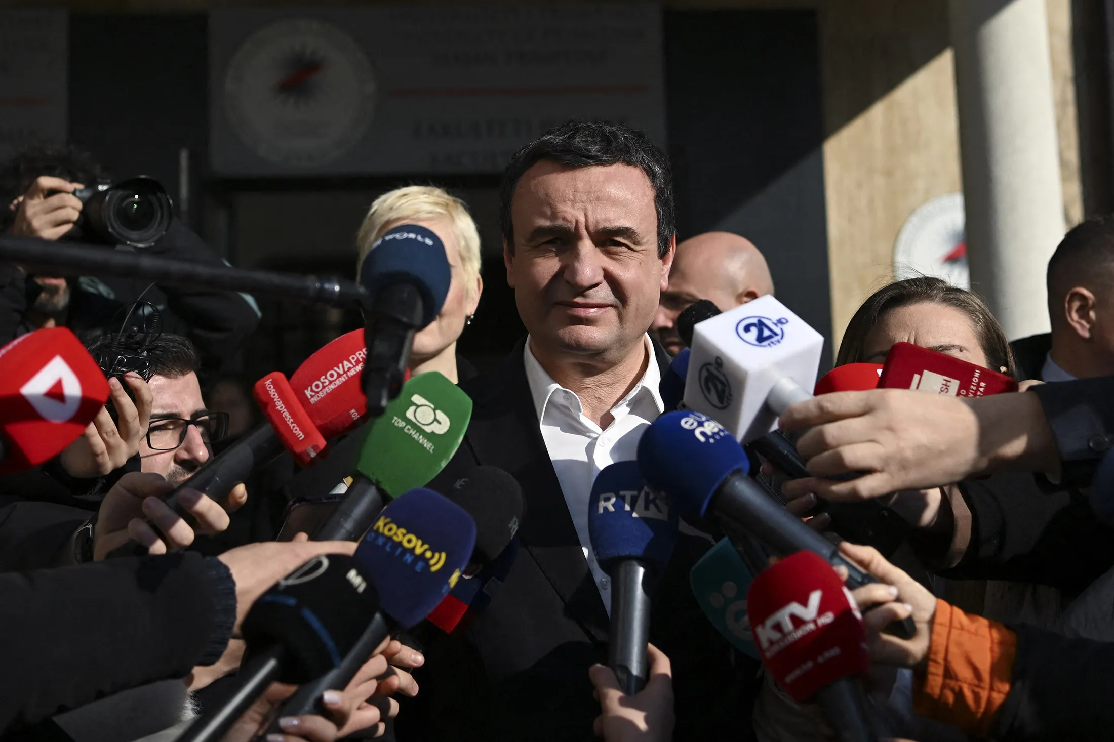Albin Kurti speaks to members of the media outside a polling station during the legislative elections in Pristina, Kosovo, on Feb. 9.