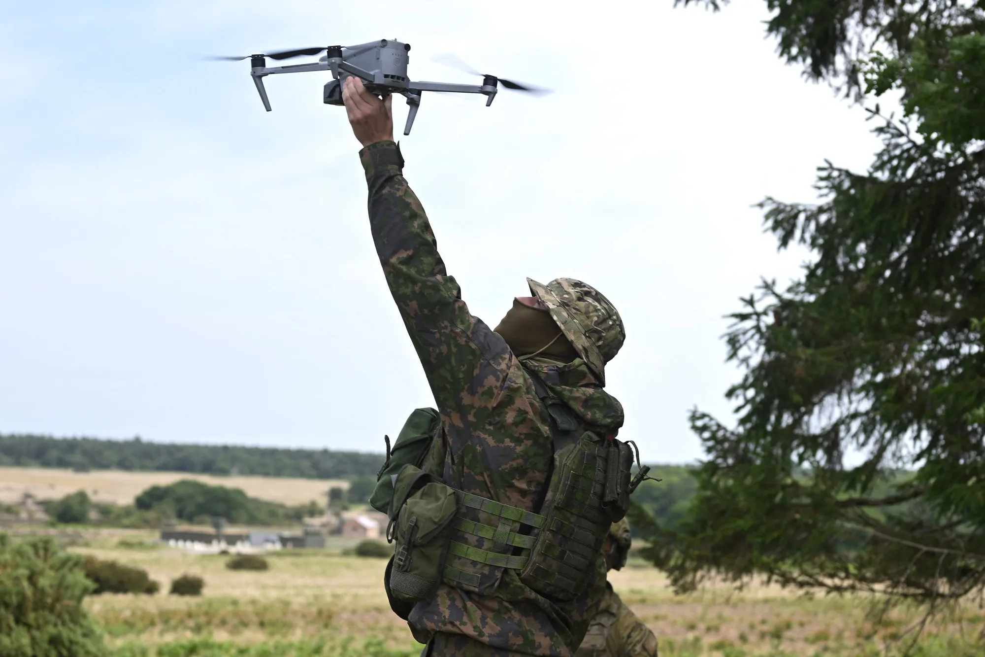 A soldier demonstrates a drone flying during a training exercise for Ukrainian troops in England in June 2025.
