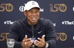 US golfer Tiger Woods speaks during a press conference at the British Open golf championship in St Andrews, Scotland, Tuesday, July 12, 2022. The Open Championship returns to the home of golf on July 14-17, 2022, to celebrate the 150th edition of the sport's oldest championship, which dates to 1860 and was first played at St. Andrews in 1873. (AP Photo/Peter Morrison)
