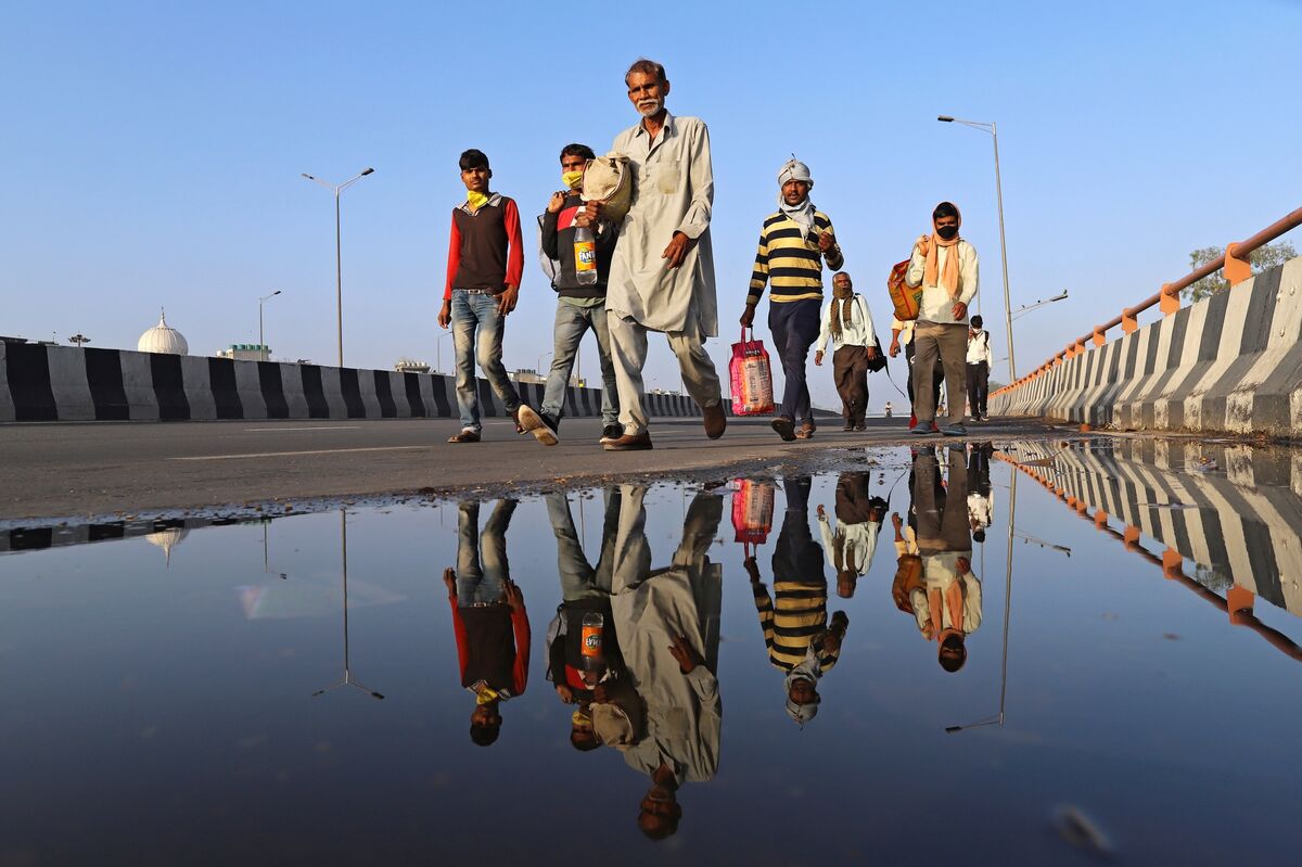 Truck Depots, Highways Checkpoints And Migrant Workers Walking on Foot As India Closes State Borders