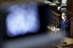 Yoshihide Suga, Japan's prime minister, wears a protective face mask as he delivers his policy speech during an extraordinary session at the lower house of the parliament in Tokyo, Japan, on Monday, Oct. 26, 2020.
