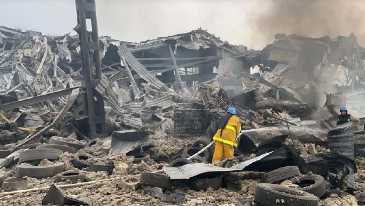 Emergency services attend the scene of an early morning Russian air strike, in Zaporizhzhia, Ukraine, on Nov. 25.