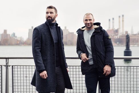 On Leddy: (Here) Houndstooth overcoat by Ovadia & Sons ($1,595); turtleneck by Ovadia & Sons ($395); cargo pants by Duluth Trading Company (Leddy's own, throughout). (Above) Ten-C fishtail parka by C.P. Company ($2,200; sweater by Todd Snyder ($295); chambray shirt by Orslow ($250). On Boychuk: (Here) Down parka by Stone Island ($1,785); sweatshirt by Stone Island ($225); jeans by DL 1961 (Boychuk's own, throughout); North Flag watch by Tudor ($3,550). (Above) Suede belted carcoat by Eidos Napoli ($2,995); turtleneck by Alex Mill ($195).