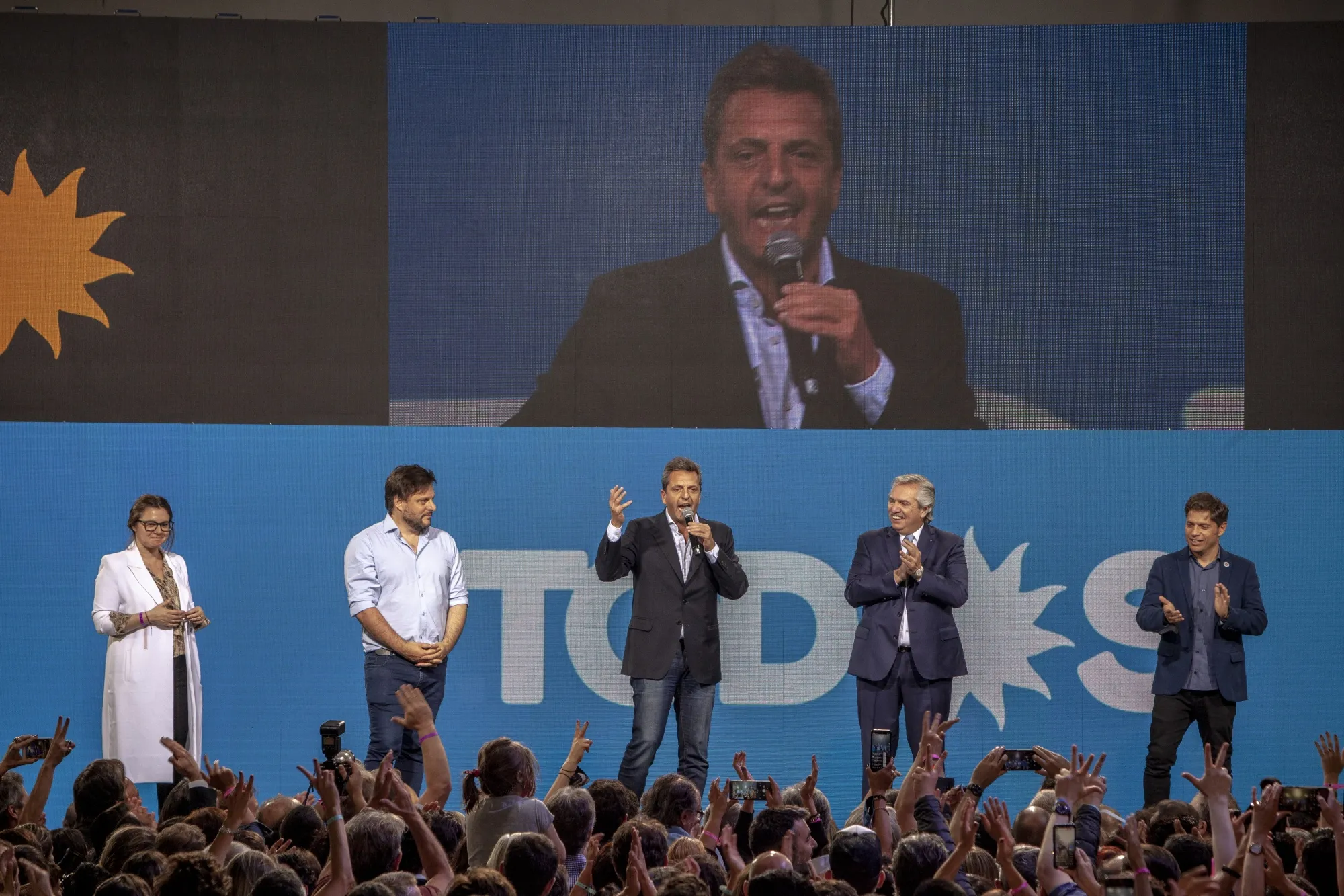 Sergio Massa, center, speaks during an election night rally at the Frente de Todos party headquarters in Buenos Aires in 2021. 