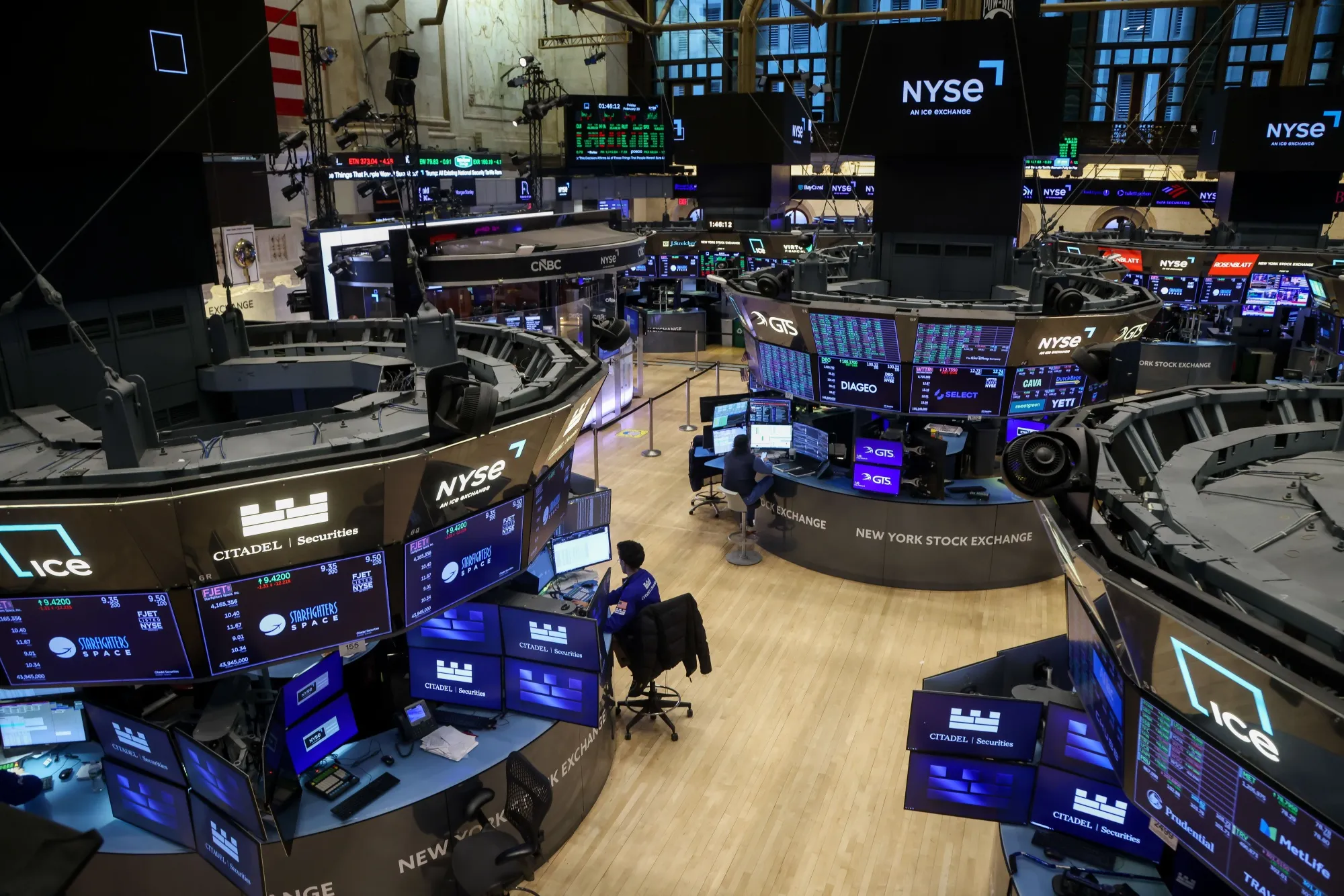 Traders work on the floor of the New York Stock Exchange.