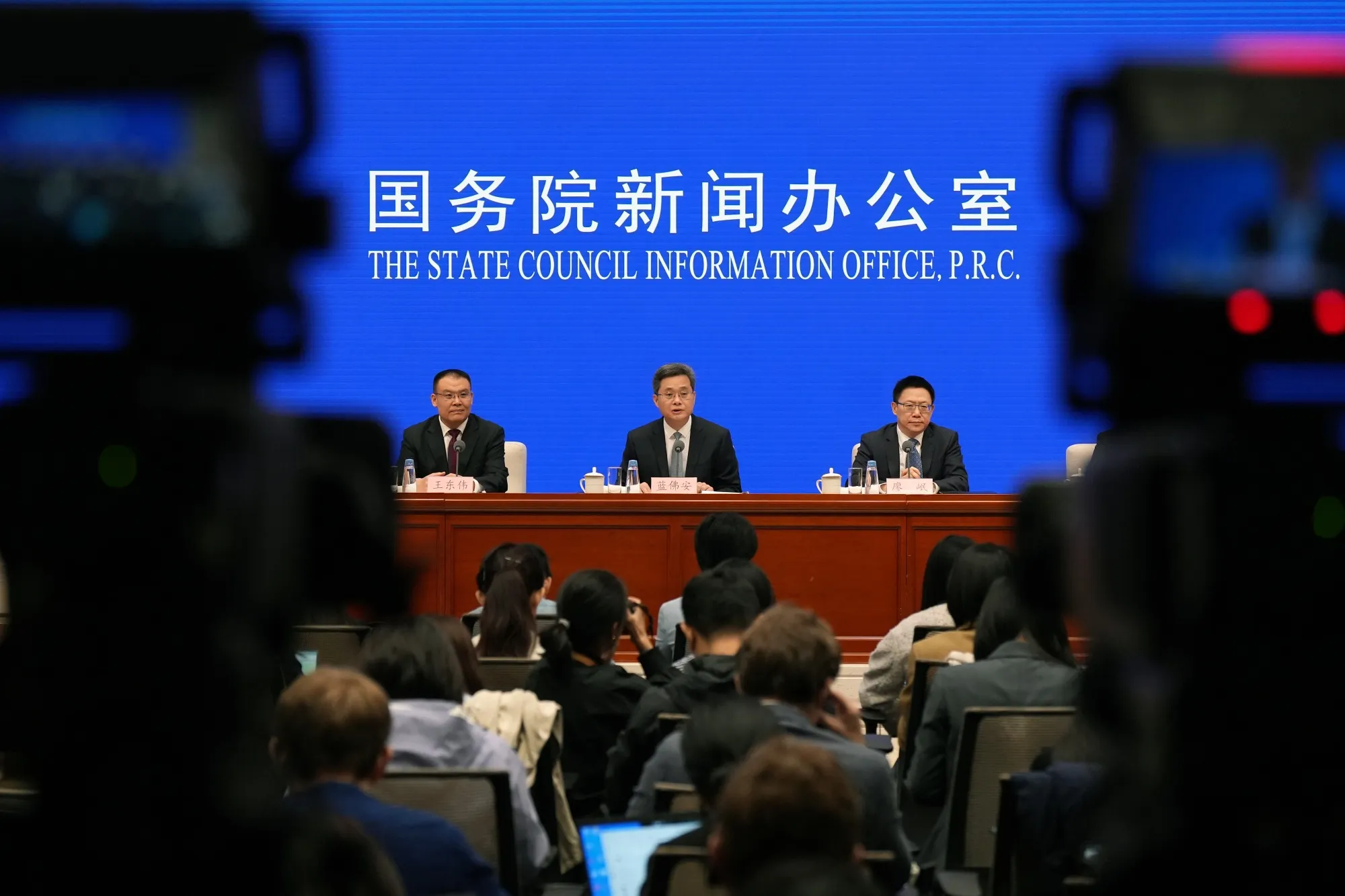 Lan Fo'an, China's finance minister, center, with Wang Dongwei, vice minster of finance, left, and Liao Min, vice minster of finance, during a news conference in Beijing, China, on Saturday, Oct. 12, 2024. China will allow local governments to issue bonds to support the ailing property sector as it pushes to put a floor under an economic slowdown.
