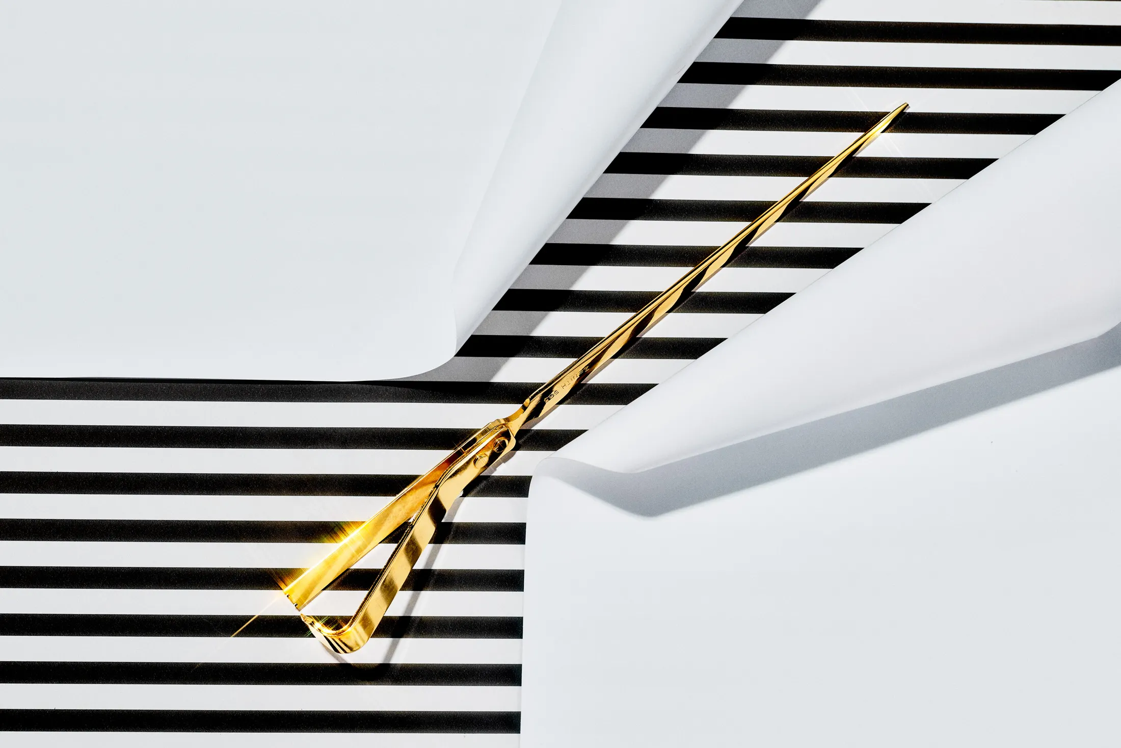 Zenith 585 letter opener in gold.
