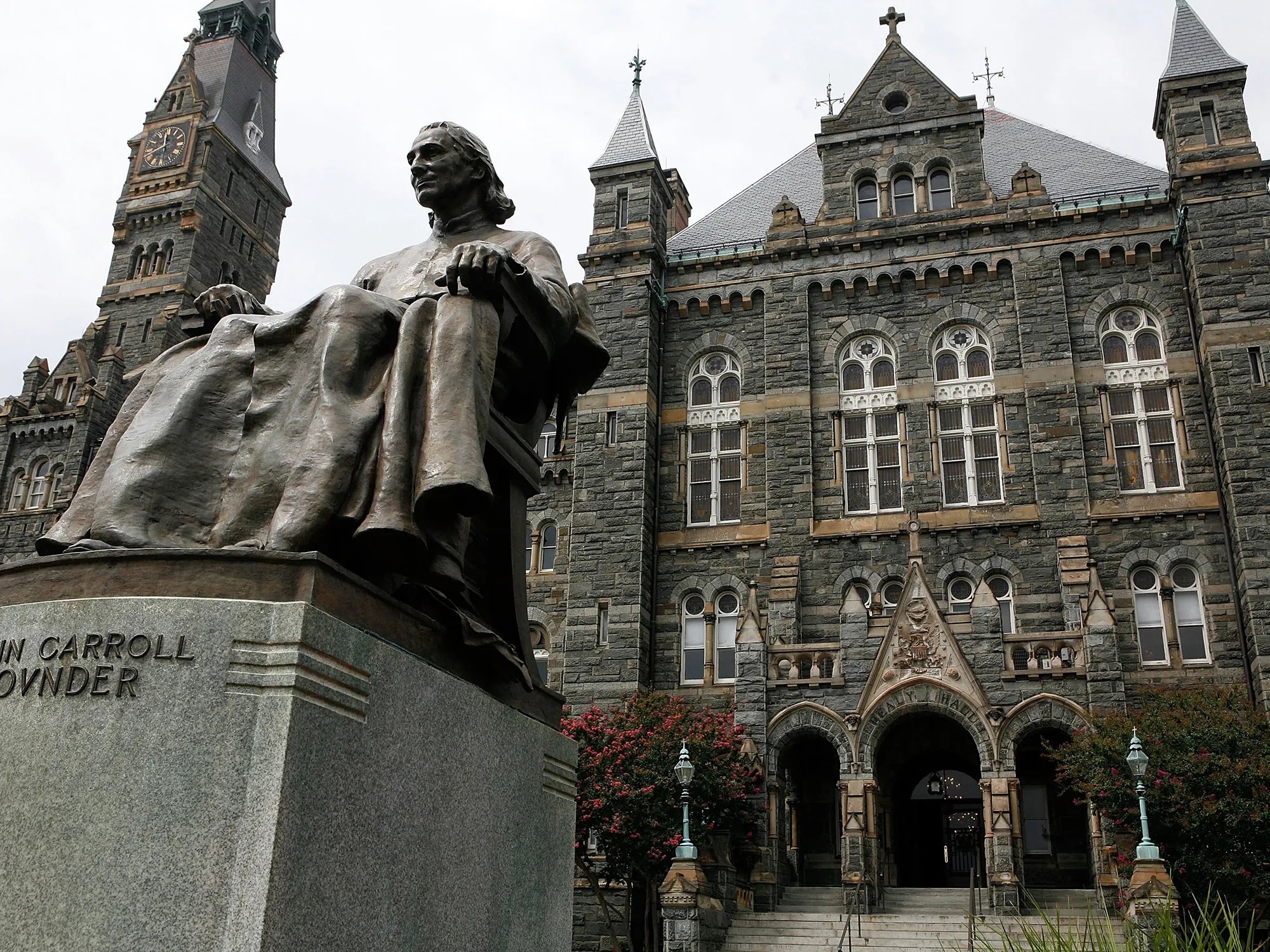 A statue of John Carroll, founder of Georgetown University, sits before Healy Hall on the school's campus in Washington, D.C.