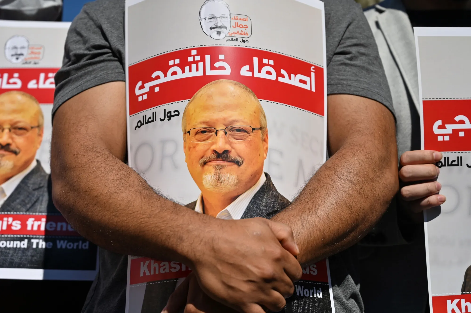Demonstrators hold images of murdered Saudi journalist Jamal Khashoggi&nbsp;an event marking the&nbsp;anniversary of his assassination in front of the Saudi Arabia consulate in Istanbul.
