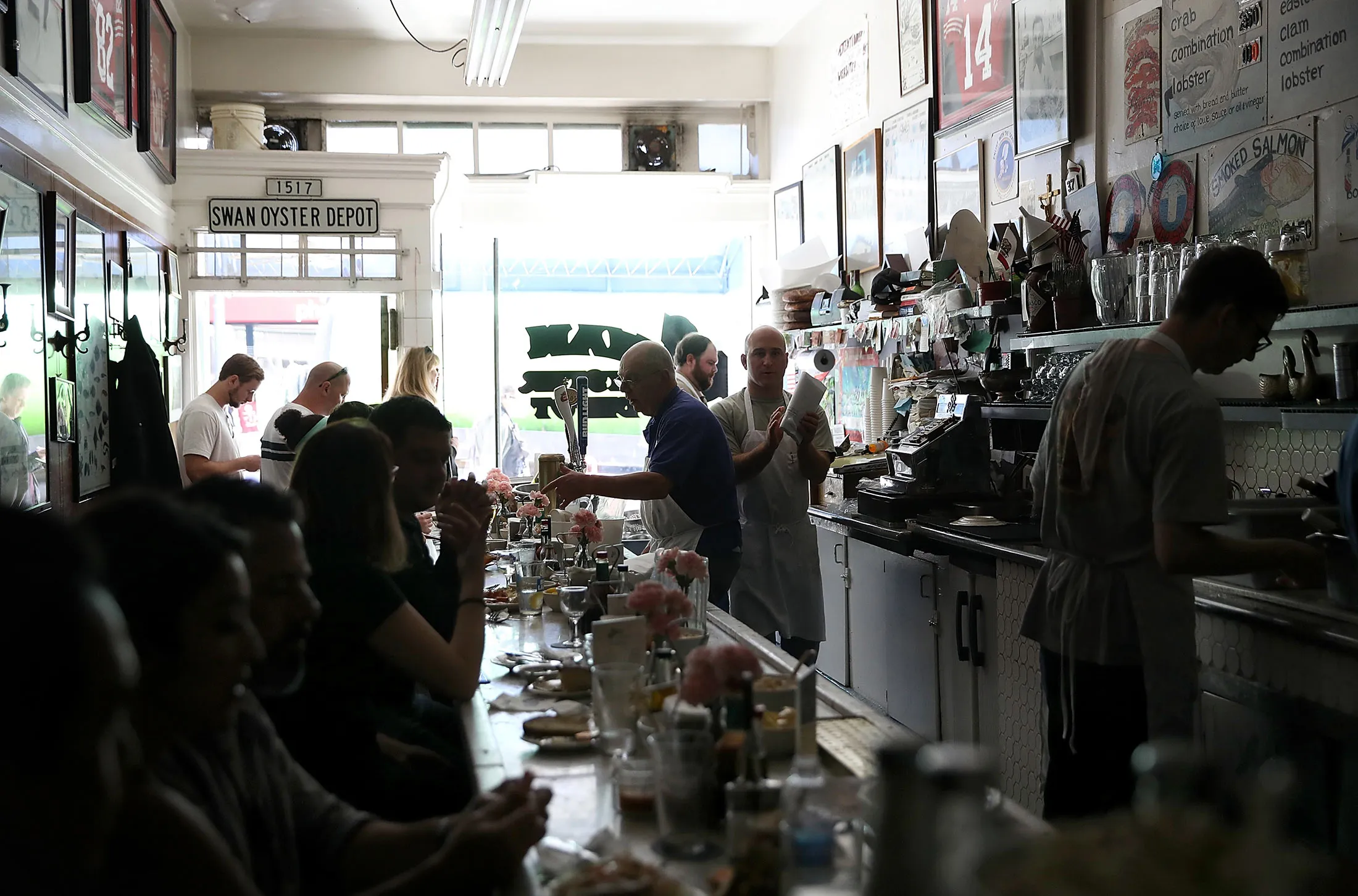 Swan Oyster Depot patrons sit in the dark during a citywide power outage on April 21, in San Francisco, Calif.
