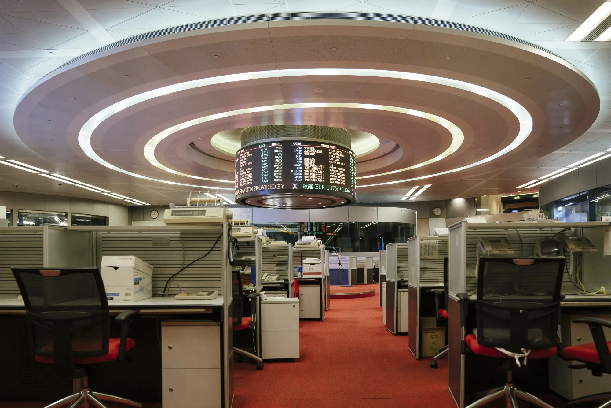 Booths stand emptied on the trading floor of the Hong Kong Stock Exchange.