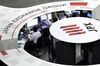 Employees work at the Tokyo Stock Exchange (TSE), operated by Japan Exchange Group Inc. (JPX), in Tokyo, Japan, on Friday, Dec. 28, 2018. Japanese shares fell, with the Topix index capping its worst annual performance since 2011, in a year that saw U.S.-China trade tensions deal a heavy blow to investor sentiment.