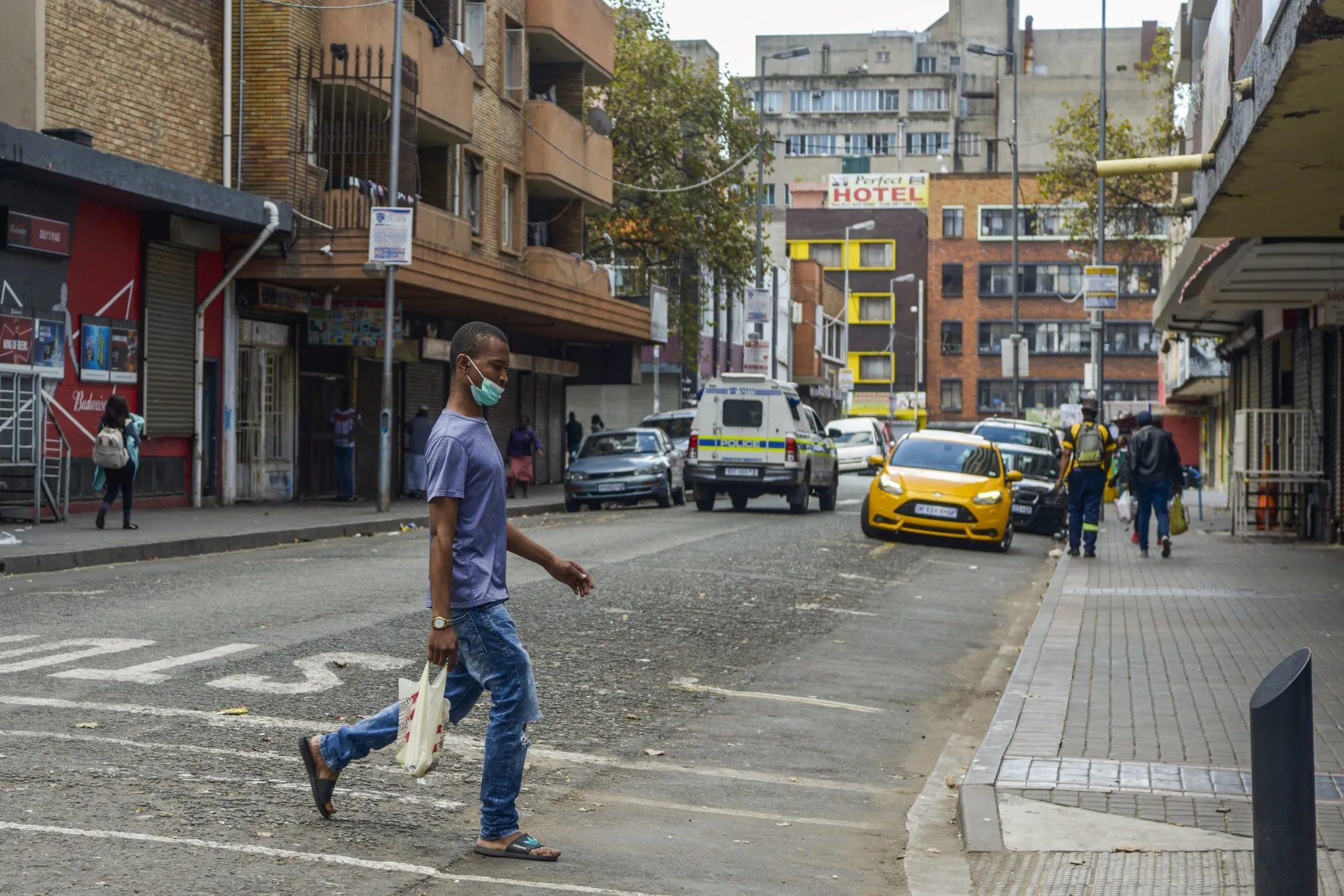 A pedestrian&nbsp;crosses a&nbsp;road&nbsp;in the the Central Business District of Johannesburg on April 6.