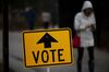 A "Vote" sign stands outside a polling station at Hoyt Park Grand Hall in Wauwatosa, Wisconsin, U.S., on Tuesday, Nov. 6, 2018. More than 34 million ballots have been cast in early voting so far, shattering records in states such as Texas and Florida, where Senate and gubernatorial contests have grabbed national attention.