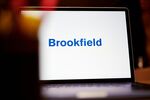 The Brookfield Asset Management logo on a laptop computer arranged in New York, US, on Wednesday, Nov. 8, 2023. Brookfield Asset Management raised $26 billion in the third quarter and said it's on track to bring in close to $150 billion in fresh capital this year, despite a tough fundraising environment.