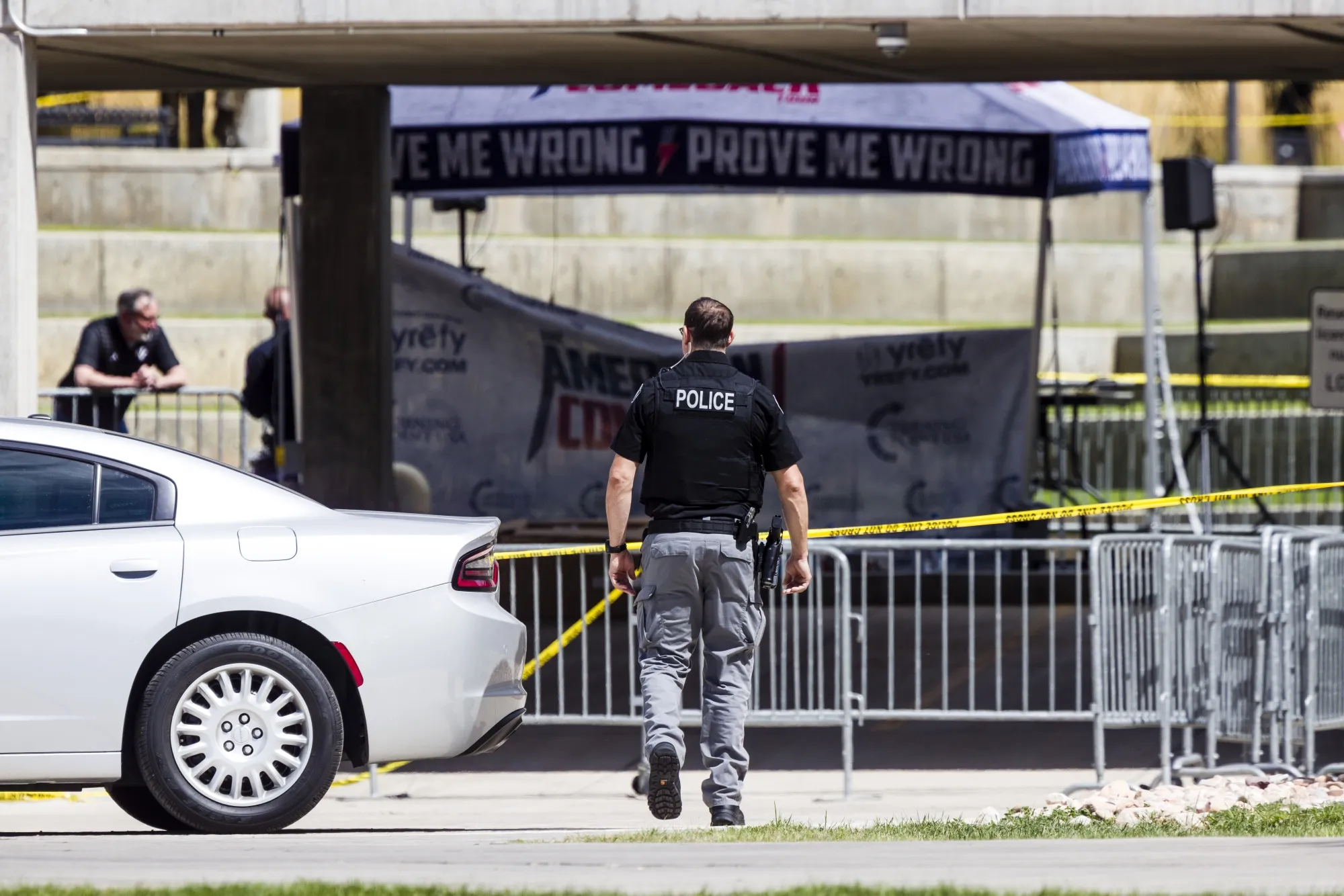 A police officer walks toward the crime scene where Charlie Kirk was shot at the Utah Valley University campus in Orem, Utah on Sept. 12, 2025.