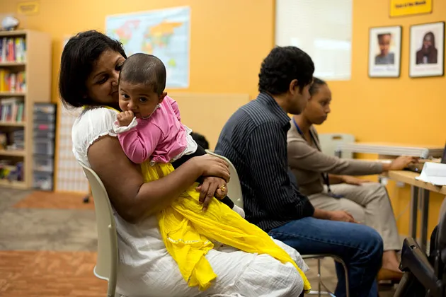A family enrolls into Obamacare at Mary's Center in Washington, on Oct.1, 2013
