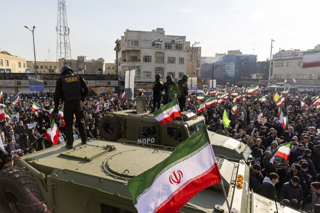 Security forces monitor a rally in Tehran on Jan. 12. 
