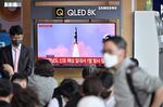 People watch a television screen showing a news broadcast with file footage of a North Korean missile test, at a railway station in Seoul .