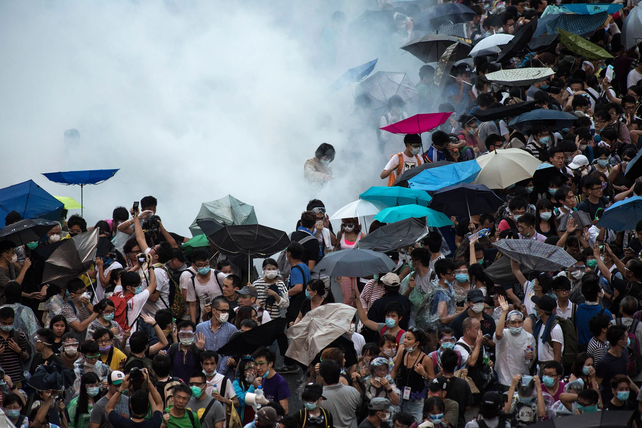 Police fire tear gas at demonstrators during a protest near central government offices in Hong Kong, on Sept. 28, 2014.

