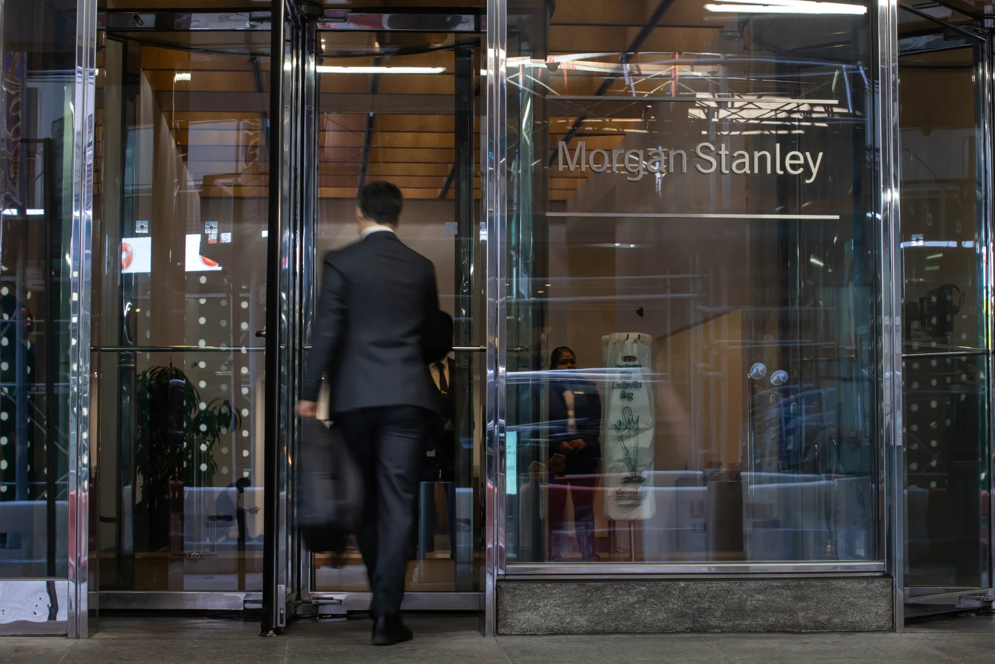 A worker enters Morgan Stanley global headquarters in New York.