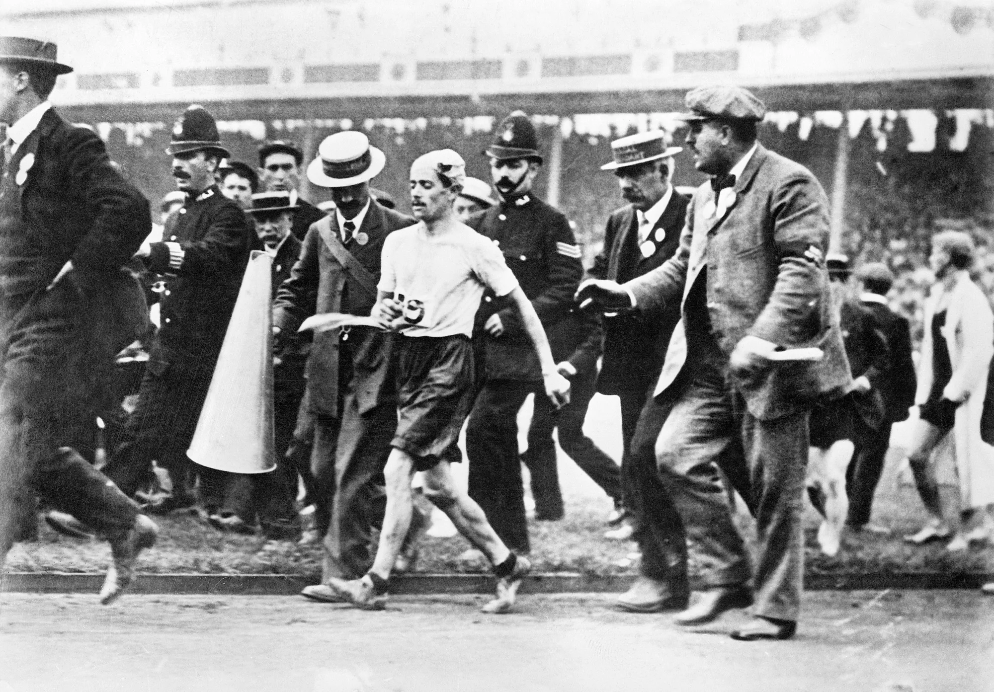 Being first across the line didn’t get the gold&nbsp;for Dorando Pietri, who was disqualified due to the helping hands at the 1908 London Olympics.
