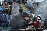 Anti-government protesters online at a barricade in Kiev, Ukraine, on Feb. 5