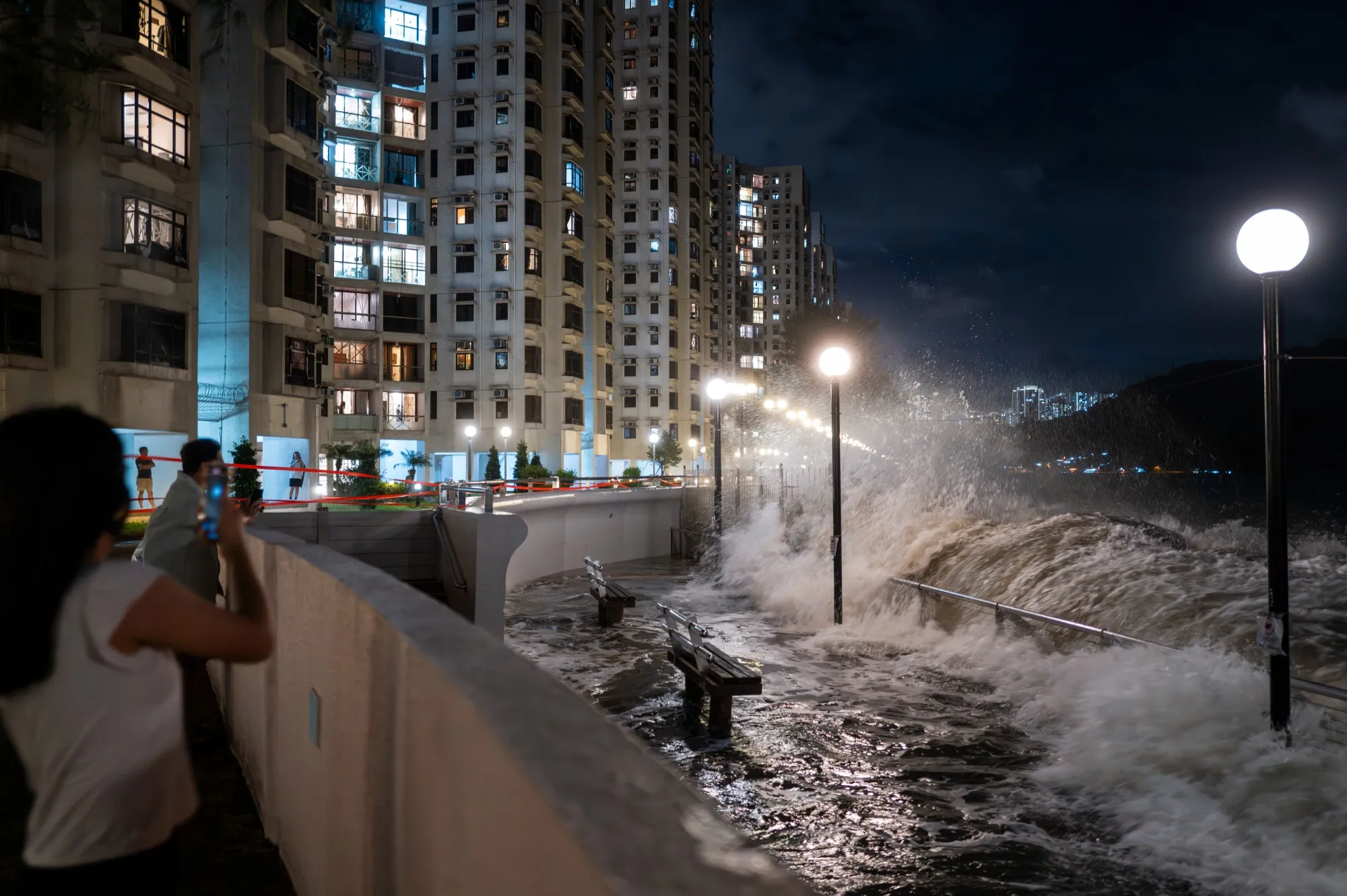 Waves crash over a promenade as observers watch in Heng Fa Chuen area during Super Typhoon Ragasa in Hong Kong, China, on&nbsp;Sept. 23.