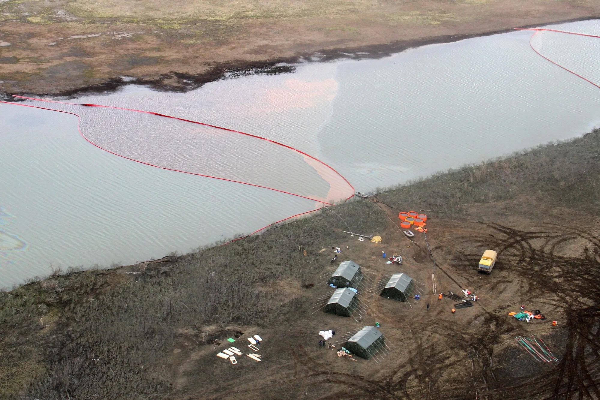 A cleanup crew operates on June 2, 2020 in Norilsk, Russia after&nbsp;20,000 tons of diesel spilled into the Ambarnaya River.