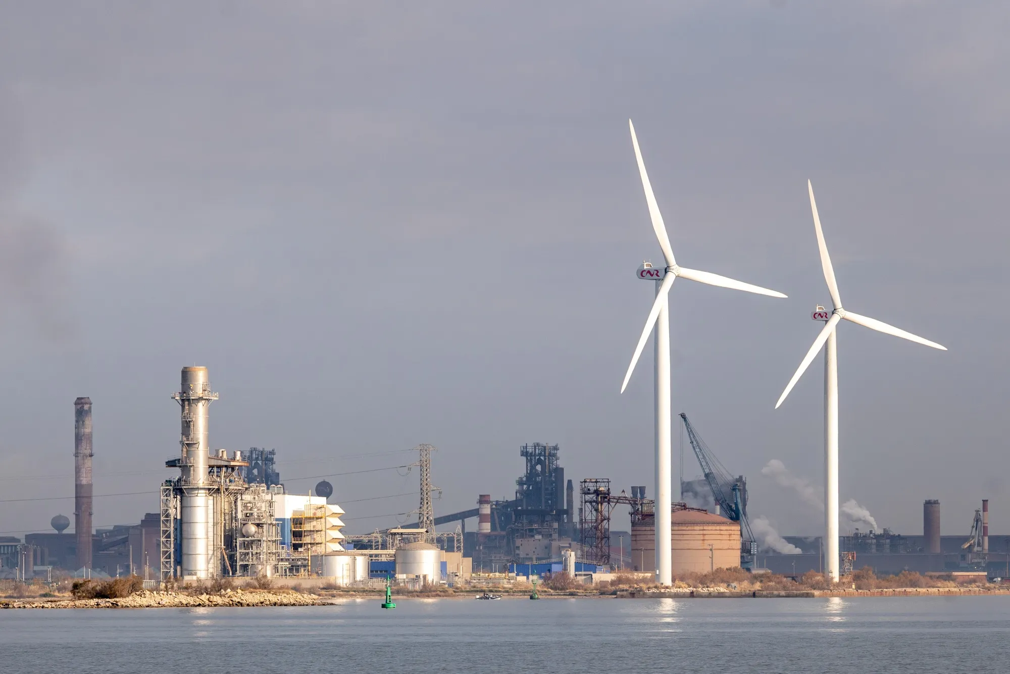 Wind turbines near the Engie SA Combigolfe combined cycle gas turbine plant in Fos-sur-Mer, France.