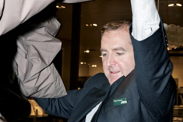 The author struggles to make a bed. John Lewis will hire about 500 temps this year