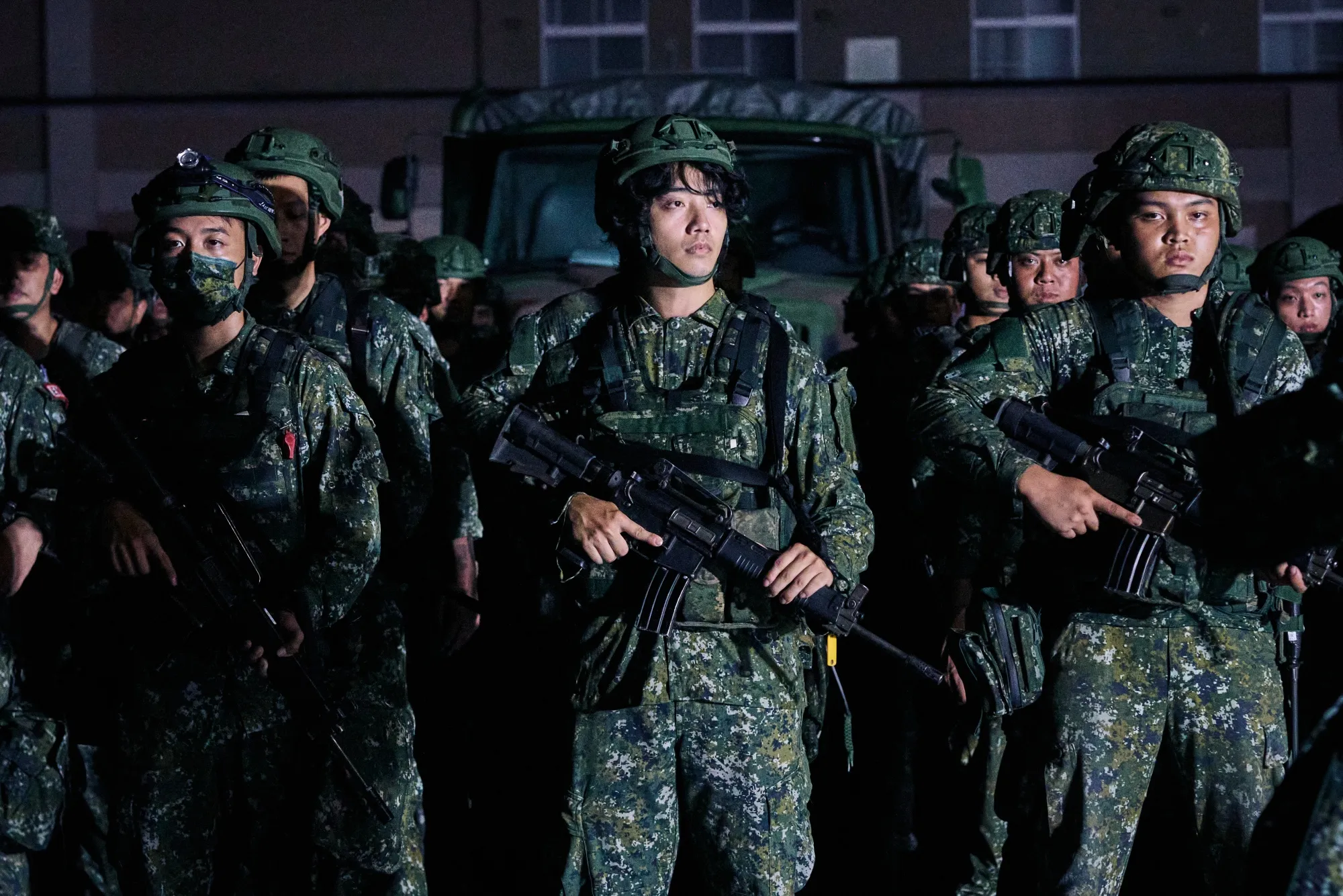 Soldiers line up to participate in the war games, which have become broader and more realistic as the island rehearses for the possibility of war with China.