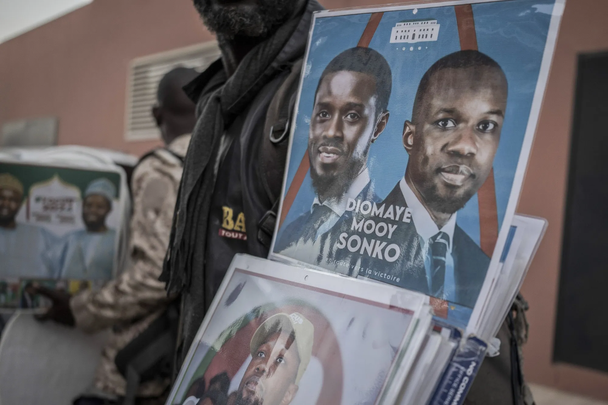 A vendor sells merchandise in support of Ousmane Sonko.