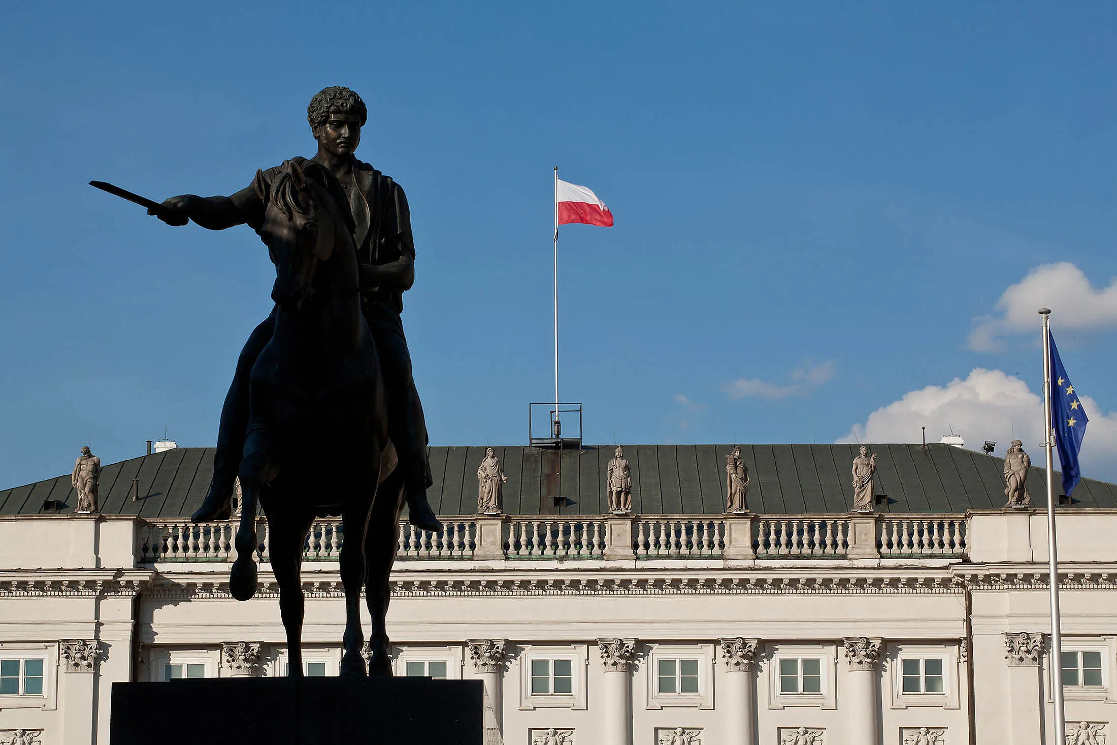 A Polish national flag flies above the presidential palace in Warsaw, Poland.
