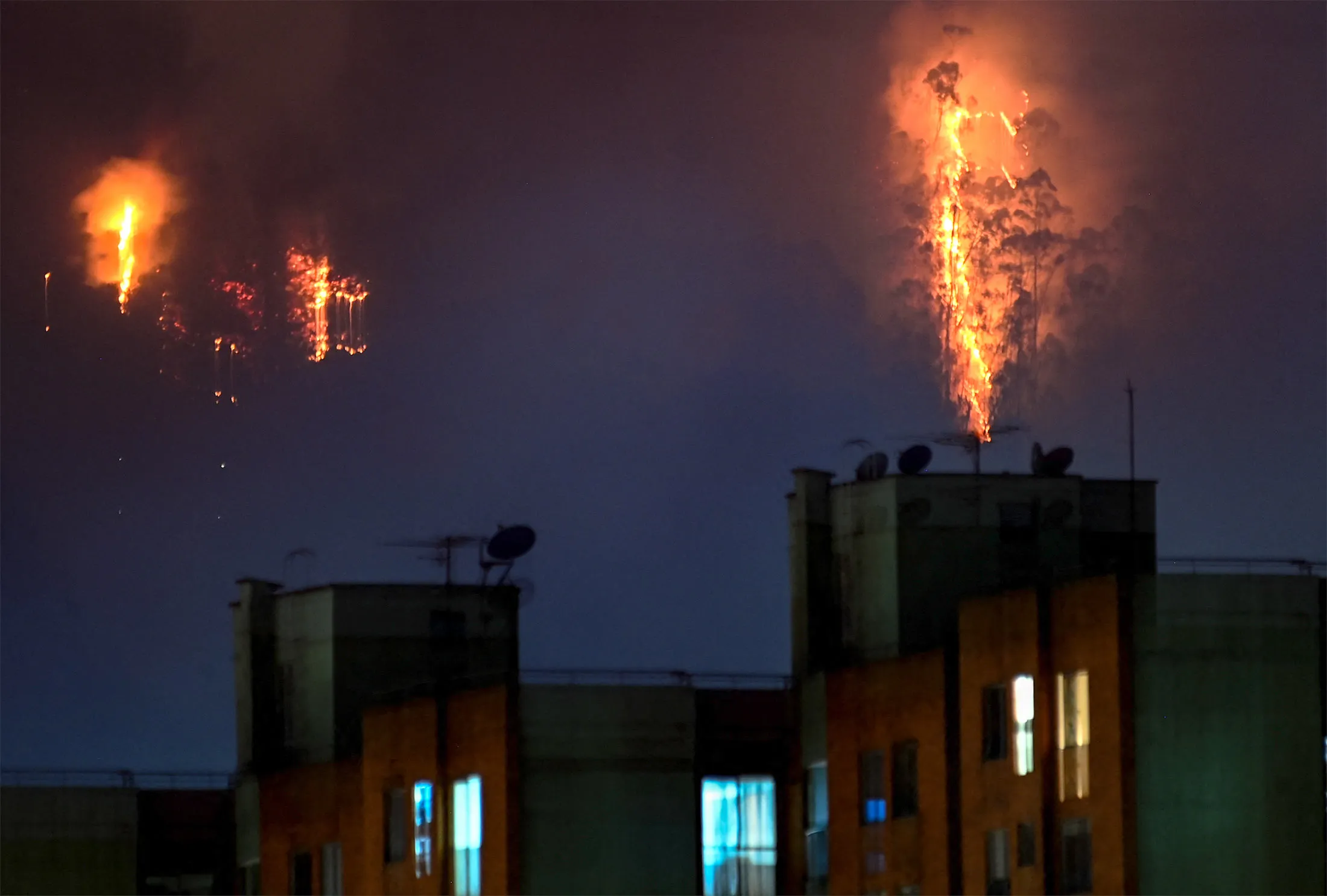 Flames rise from a wildfire in Bogota on Wednesday.