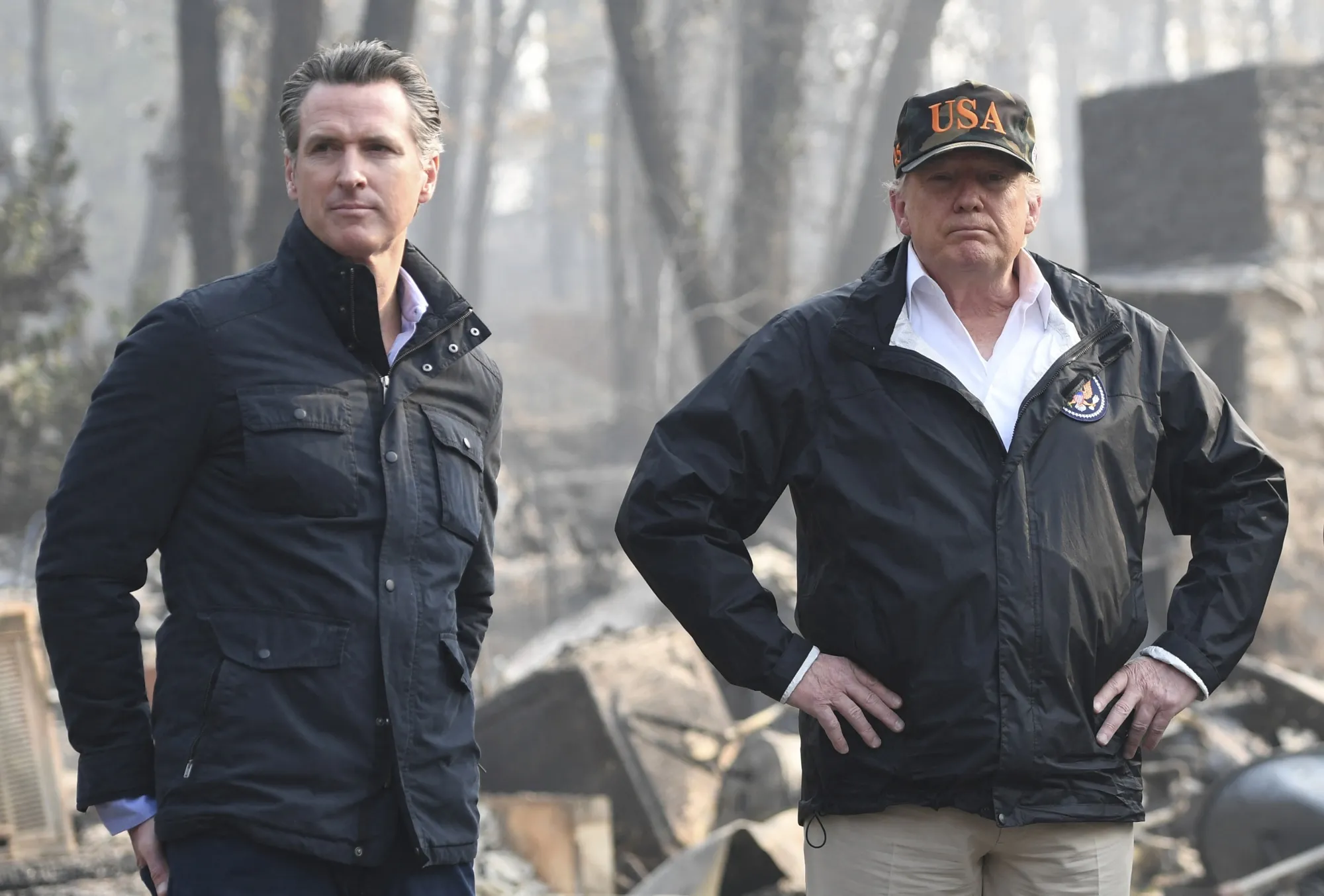 Gavin Newsom and Donald Trump survey damage from wildfires in Paradise, California in 2018.