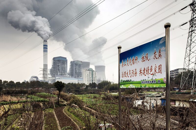 Emissions rise from cooling towers at a coal-fired power station in China.