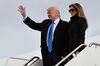 US President-elect Donald Trump and his wife Melania step off a plane upon arrival at Andrews Air Force Base in Maryland on January 19, 2017. / AFP / MANDEL NGAN (Photo credit should read MANDEL NGAN/AFP/Getty Images)