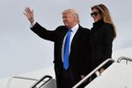 US President-elect Donald Trump and his wife Melania step off a plane upon arrival at Andrews Air Force Base in Maryland on January 19, 2017. / AFP / MANDEL NGAN (Photo credit should read MANDEL NGAN/AFP/Getty Images)