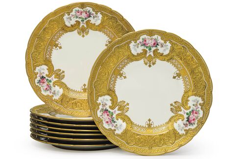 A set of eight royal crown derby porcelain parcel-gilt plates from 1902-1903, estimated to sell for $5,000 to $7,000 at Christie's.