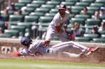 Washington Nationals' Josh Palacios (68) slides safely home in the fifth inning of a baseball game against the Atlanta Braves, Wednesday, Sept. 21, 2022, in Atlanta. (AP Photo/Brynn Anderson)