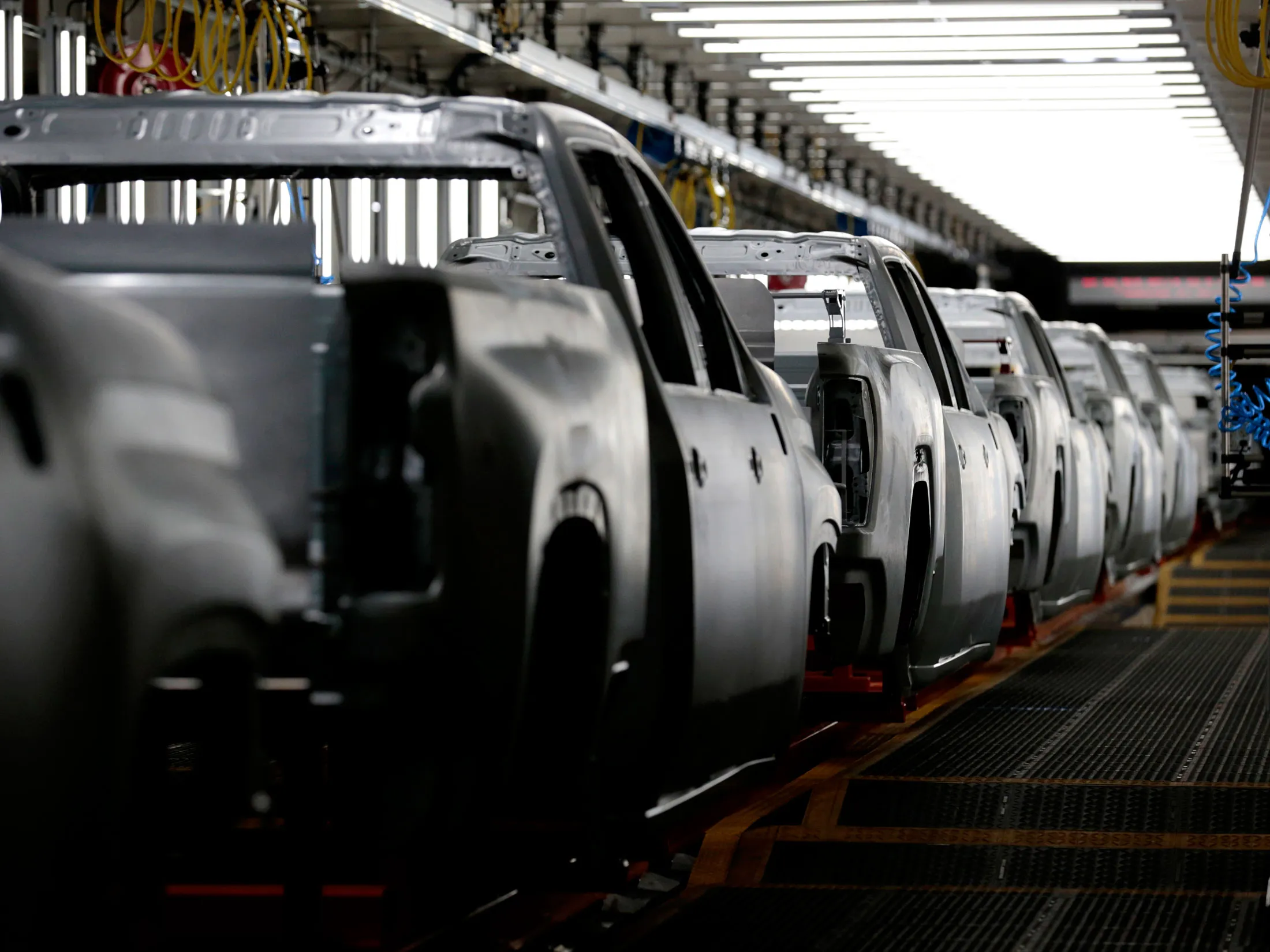 Pickup truck frames sit on the assembly line at the General Motors Co. plant in Flint, Michigan in 2019.&nbsp;